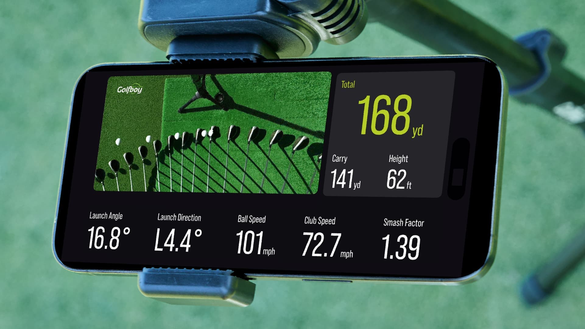 Shot analysis — An iPhone on a tripod showing distance, ball speed, and club speed